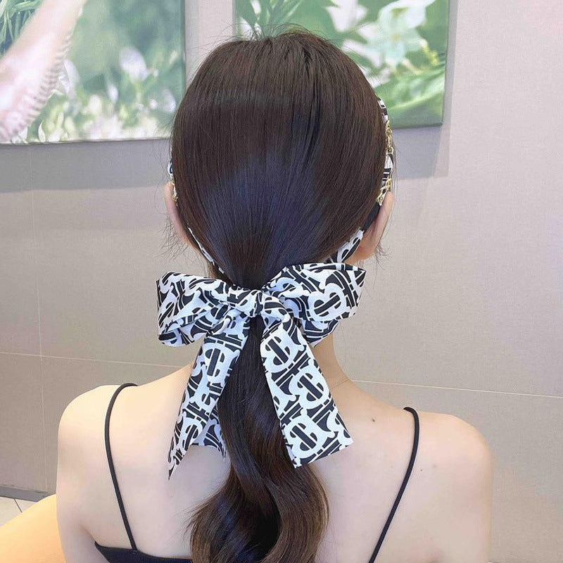 Fascia per capelli con strass e fior