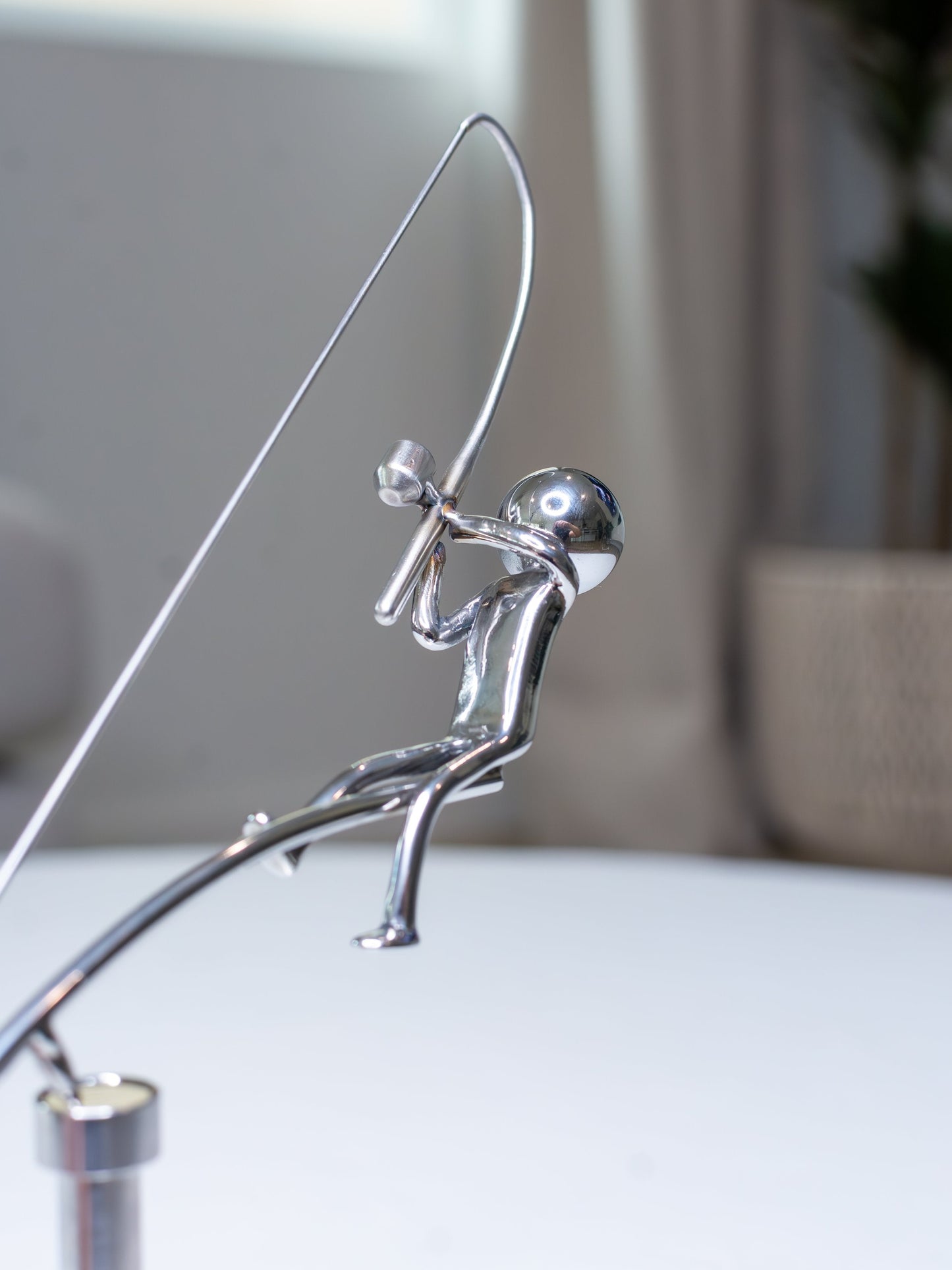 🎣La scultura del pescatore in equilibrio